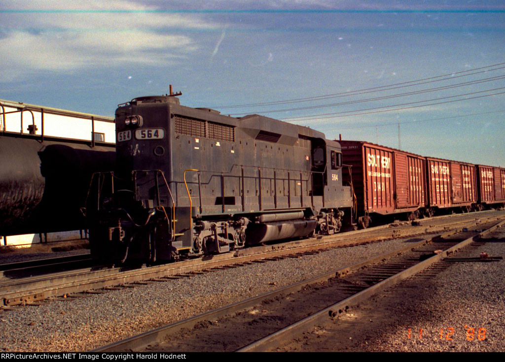 NW 564 switches a cut of cars in the yard